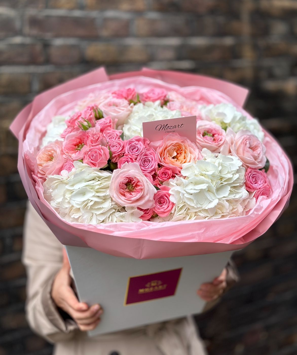 Luxurious Mozart Concierge rounded blush pink and white bouquet – elegant and luxurious.