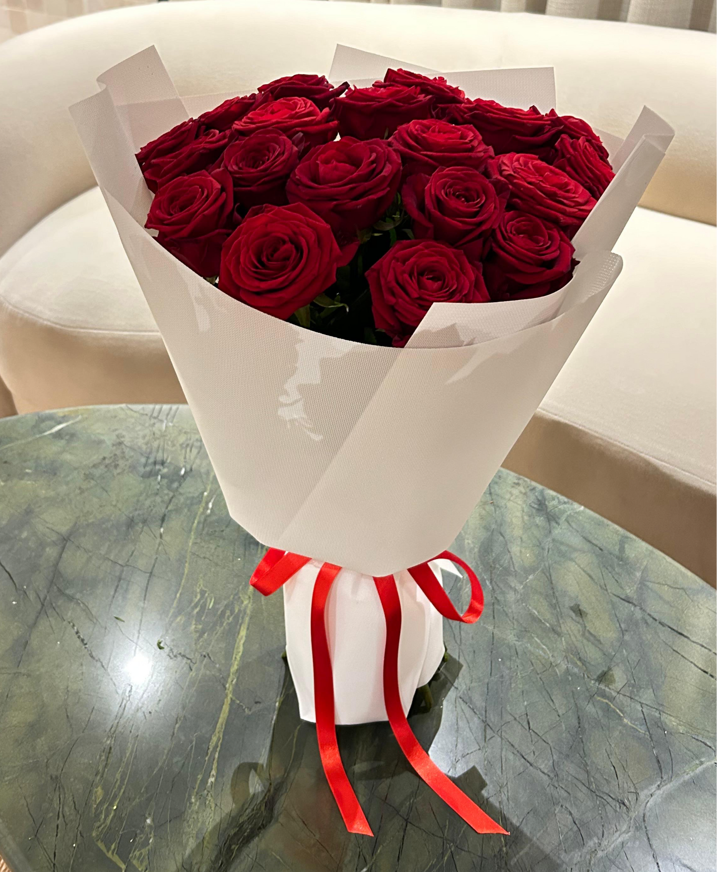 Classic red roses in a modern wrap – signature luxury bouquet from Mozart Concierge Mayfair